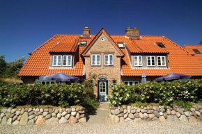 Отель Ferienhäuser im Sylter Gartenweg  Тинум